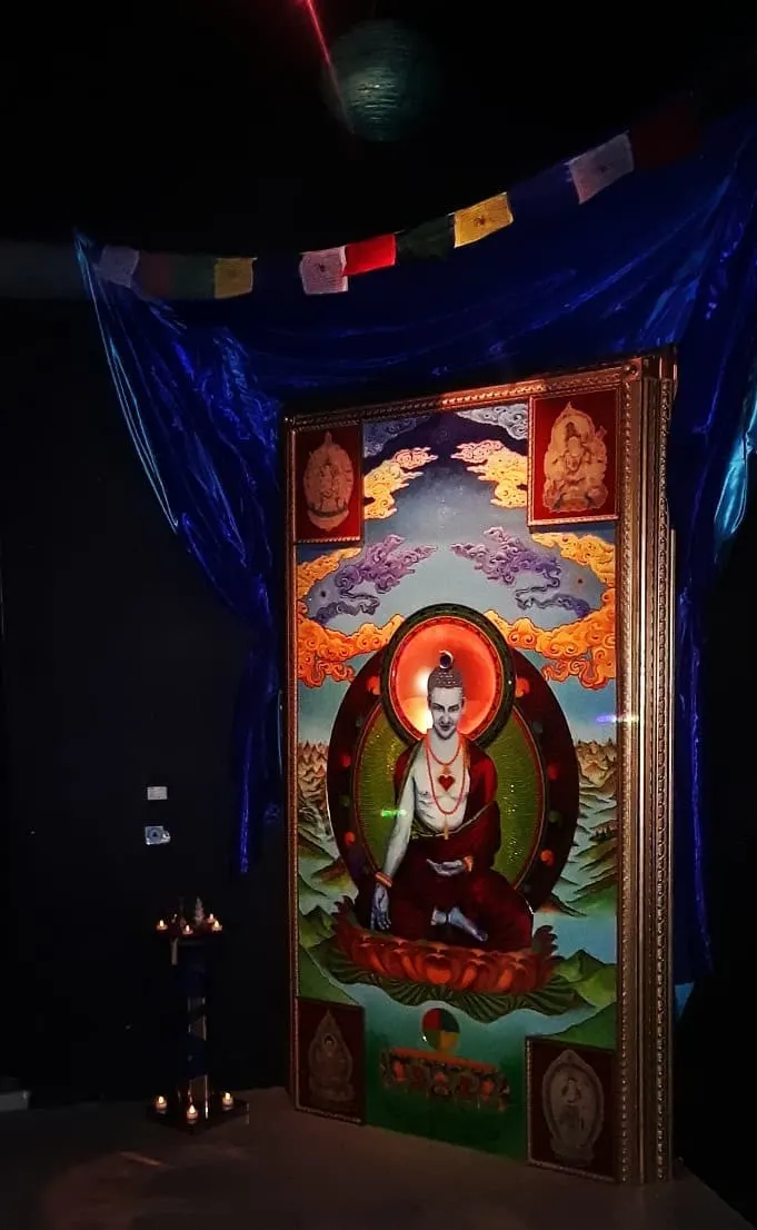 The shrine in the dark, under prayer flags
